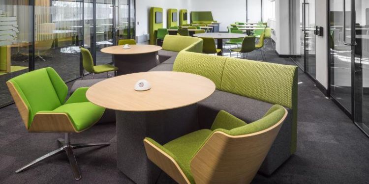 A view of differing furniture within a large study space