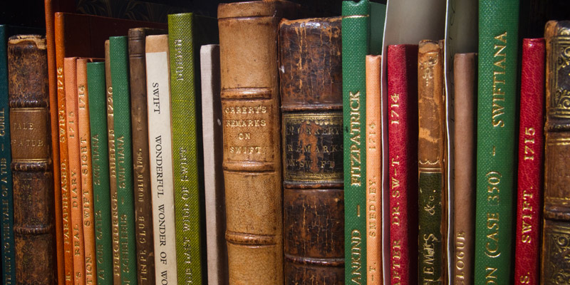 A close crop of a book shelf showing the spines of books