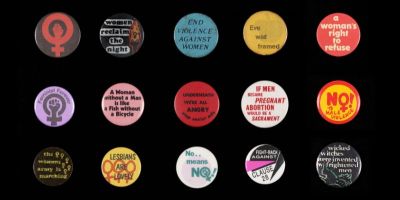 Colourful protest badges arranged in a grid layout on a black background