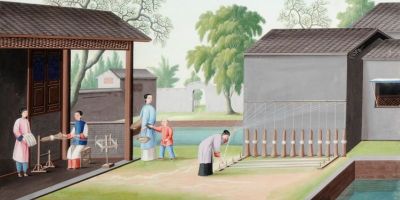 A watercolour painting showing figures in traditional Chinese dress spinning silk in between buildings, with trees in the background