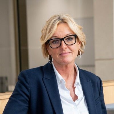 A headshot of Sarah Mulholland from the shoulders up.