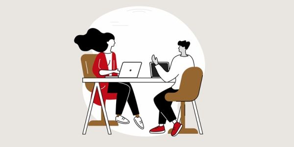 cartoon of a couple meeting with laptops