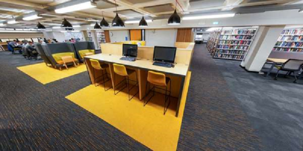 Desks with computers in the Edward Boyle Library