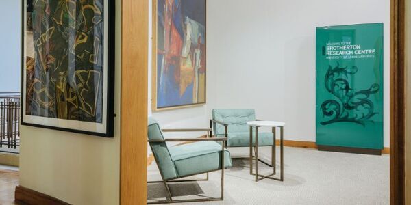 Entrance to research centre with paintings and comfortable chairs
