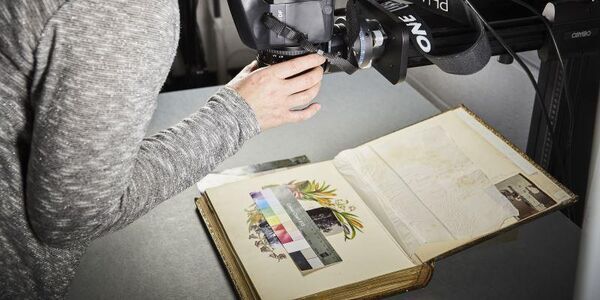 A book being photographed for digitisation