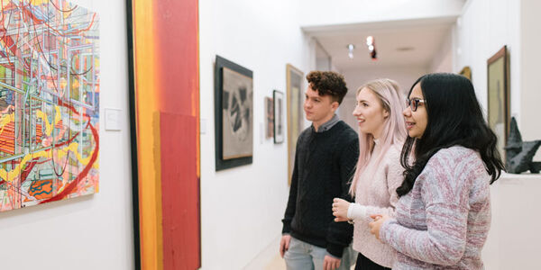 visitors looking at artwork in The Stanley and Audrey Burton Gallery