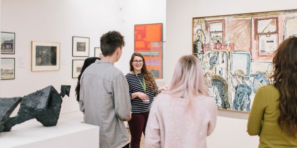 A group receiving a talk at The Stanley and Audrey Burton Gallery