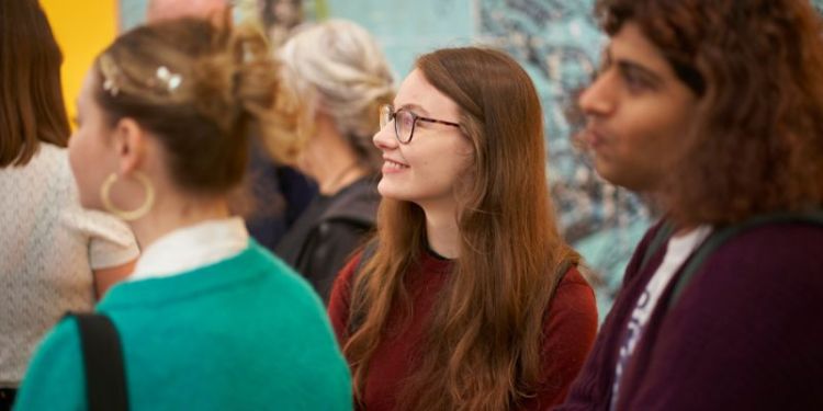 People enjoying an exhibition opening in The Stanley & Audrey Burton Gallery