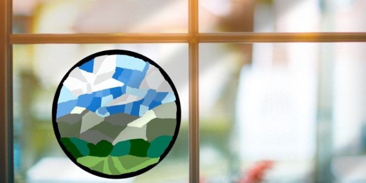 A circular mosaic design of a hilly landscape in front of a window