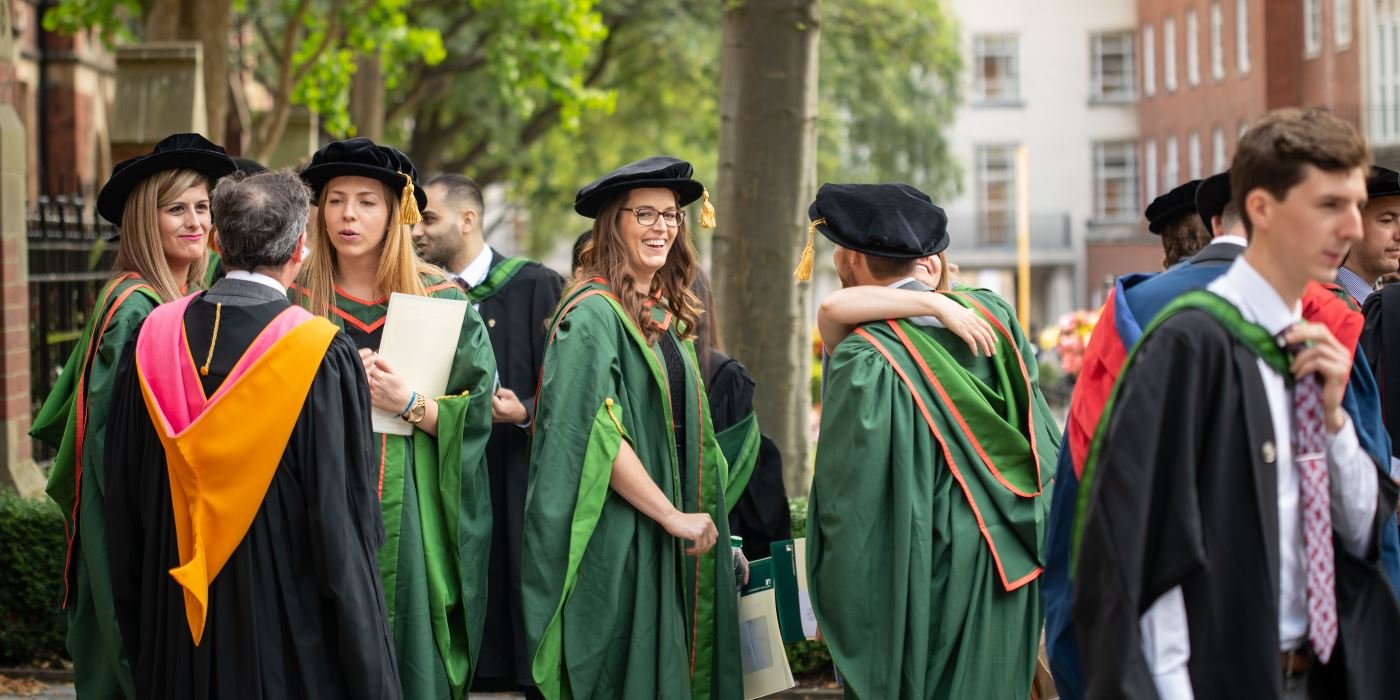 PhD graduates in their gowns