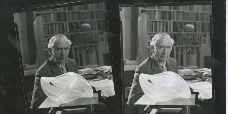 A black and white image of Herbert Read in his study at Stonegrave House with Naum Gabo’s Linear Construction II, c. 1960s.